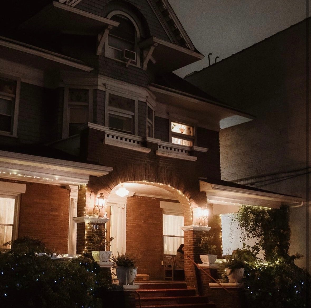 The Urbane Arts Club illuminated at night